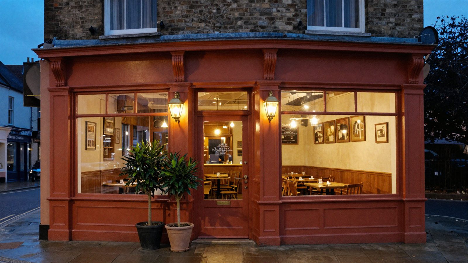 The terracotta shopfront of The Copper Fig lit up at dusk